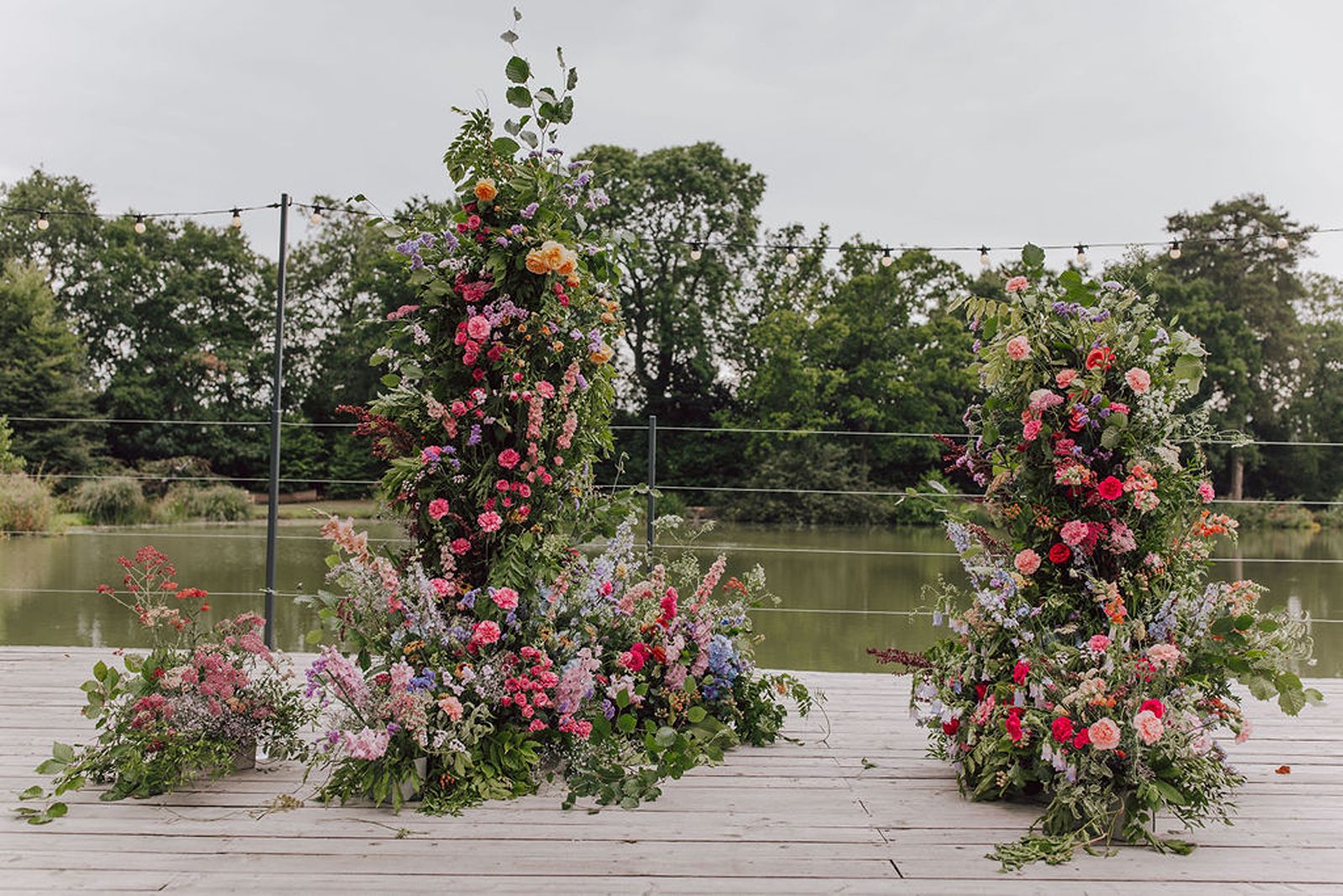 Lakeside Floral Arch at Barns & Yard Wedding venue by Bride and Bloom