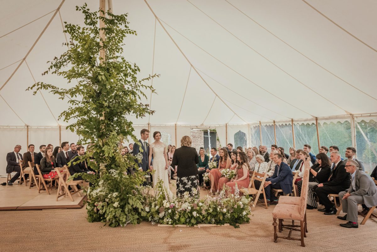 Wild Marquee Floral installation - made to look like a tree with climbing flowers by Bride and Bloom at Broadfield Court